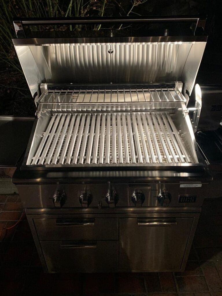 A grill for cooking meat outdoors
